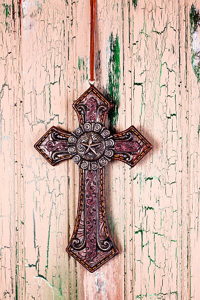 istock Cross with star center on tan background 175542703