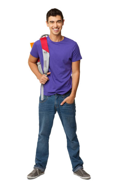 Full length portrait of young male college student standing hands in pockets with rucksack on shoulder. Vertical shot. Isolated on white.