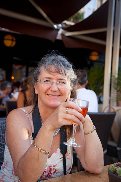 istock attractive mature woman enjoying drink 175543124
