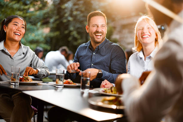 istock Happy business colleagues talking on a lunch in a restaurant. 1755436351