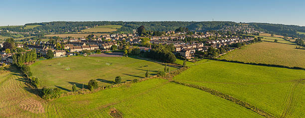 istock Country homes green fields summer suburbs aerial panorama 175543702