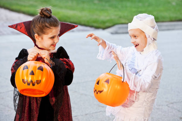 istock Children in halloween costumes 175543712