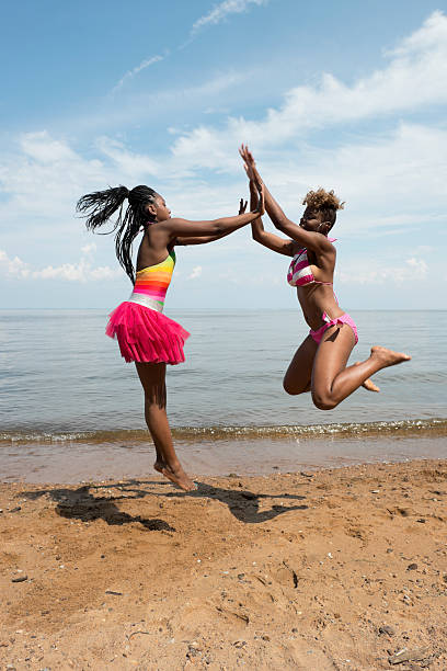 istock African American Girls Jumping With Joy 175544063