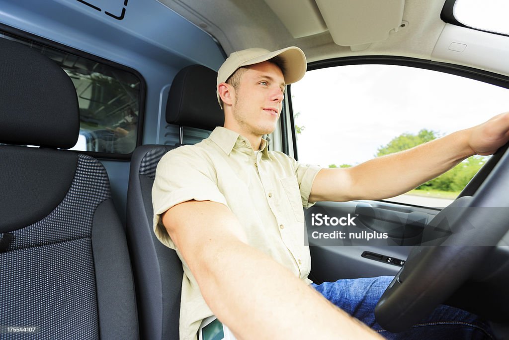 Consegna ragazzo guida - Foto stock royalty-free di Camionista