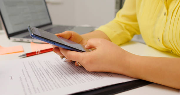 istock Female hands scrolling smart phone surfing internet. 1755441802