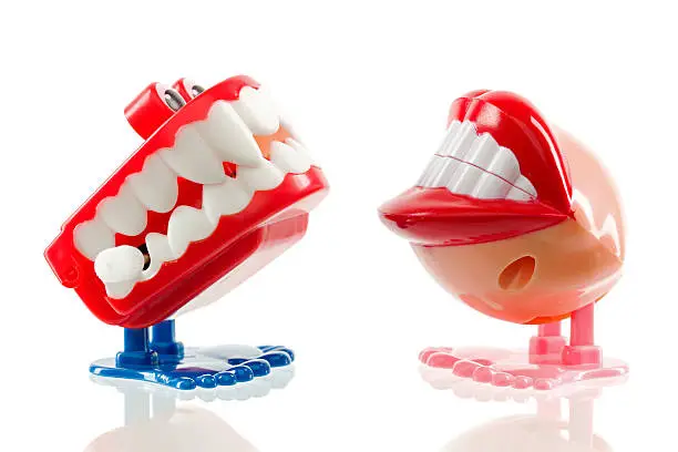 Vintage chattering teeth toy, isolated on white.