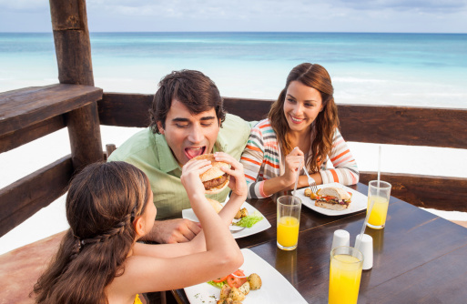 Family enjoying a meal at the beach