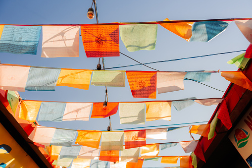 Prayer flags on the wind on the background of blue sky in Kathmandu