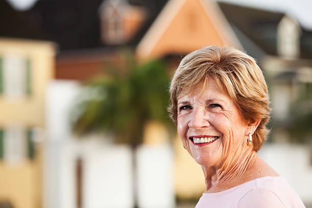 Portrait of senior woman Portrait of senior woman (60s) outdoors. Sc0560 stock pictures, royalty-free photos & images