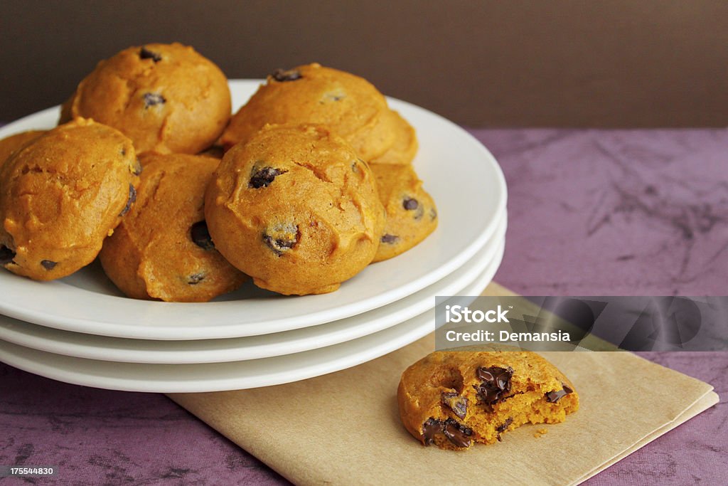 Plate of cookies "Soft pumpkin cookies, one half eaten." Pumpkin Stock Photo