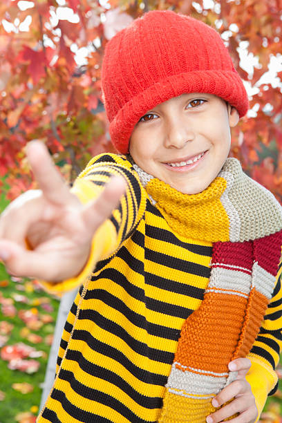 istock Autumn-Smiling boy with peace sign 175544919