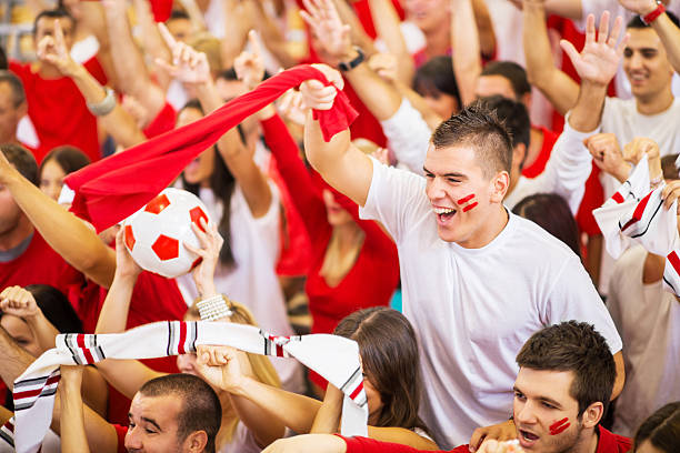 istock Group of ecstatic football fans cheering. 175545580