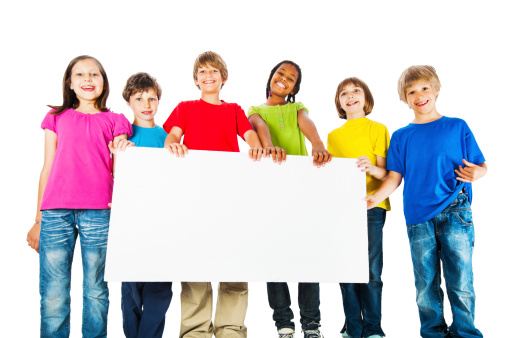 Large group of children holding big white paper for advertisements. They are isolated on white.