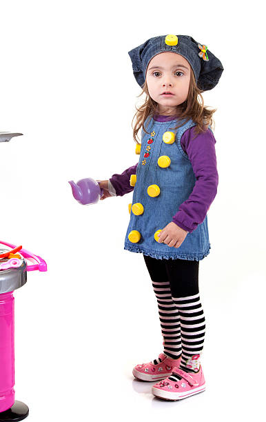 istock little girl with playing the kitchen 175545731