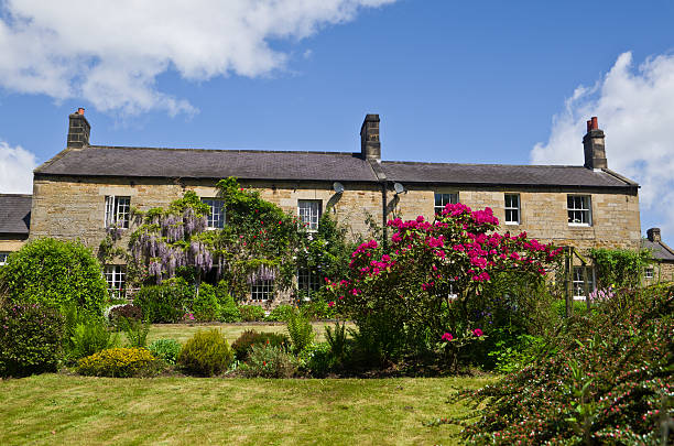 istock Two Semi-Detached Old Stone cottages in England 175545786
