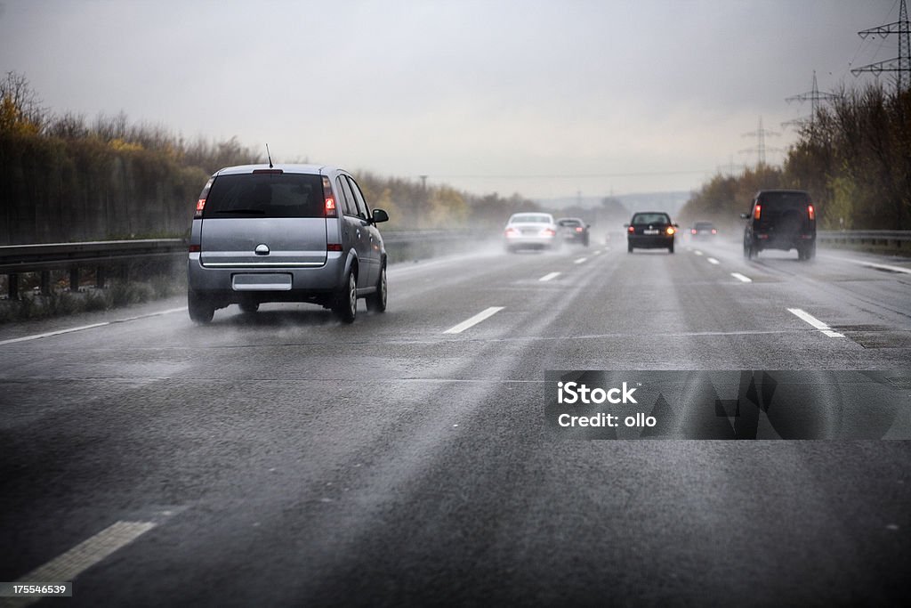 German motorway, bad weather conditions "German motorway on a rainy day, bad weather conditions - Photography has been taken during driving, some motion blur" Car Stock Photo