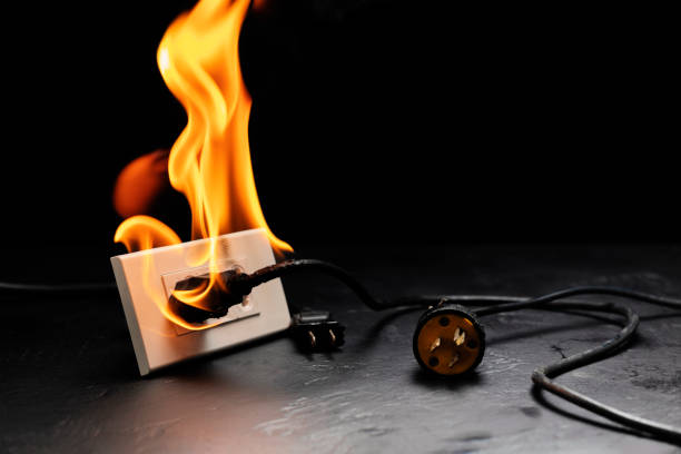 istock An electrical plug fire is caused by a short circuit of electrical current. Concept of prevention of danger. Using non-standard equipment, damaged equipment 1755467288