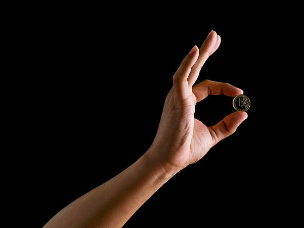 Hand of holding coin 