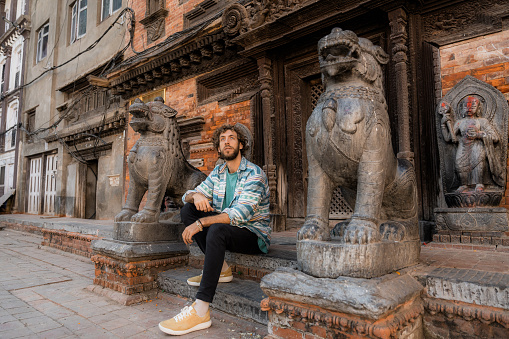 Experiential travel. Man exploring Kathmandu old town, Nepal