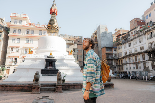 Experiential travel. Man exploring Kathmandu old town, Nepal