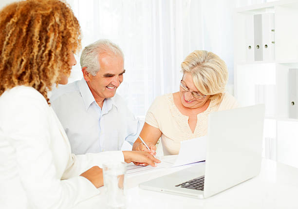 istock Senior Couple Meeting With Financial Advisor. 175547431