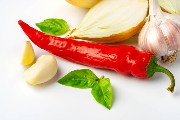 Onion, garlic and chili pepper on white background close up