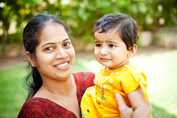 istock Indian mother with her little daughter showing affection 175547586