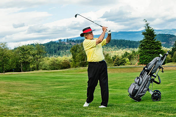 istock Senior Golfer on Golf Course Swinging Club 175547794