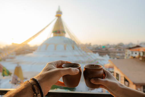 Cup of tea in the morning  with the view on white stupa in Kathmandu