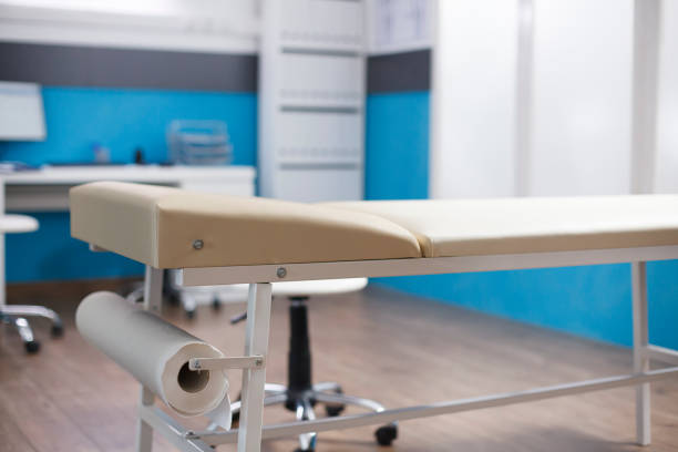 istock Vacant doctor office with a patient bed 1755495025