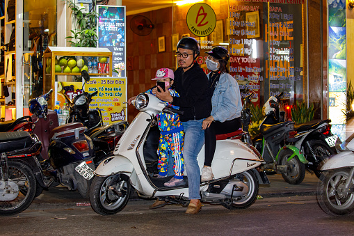 Hanoi, Bac Bo, Vietnam - November 25, 2019: People on Scooters in the city of Hanoi in Vietnam
