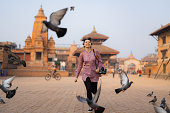 Woman with camera exploring Bhaktapur