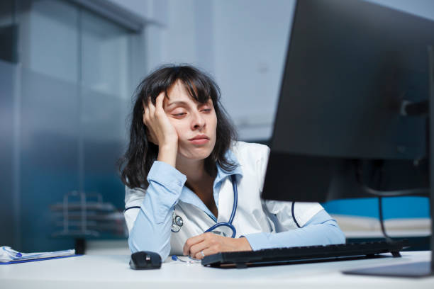 istock Physician falling asleep in clinic room 1755538746