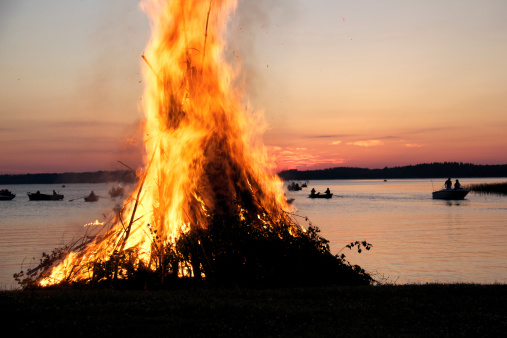 Midsummer bonfire on a Finnish lakeside.