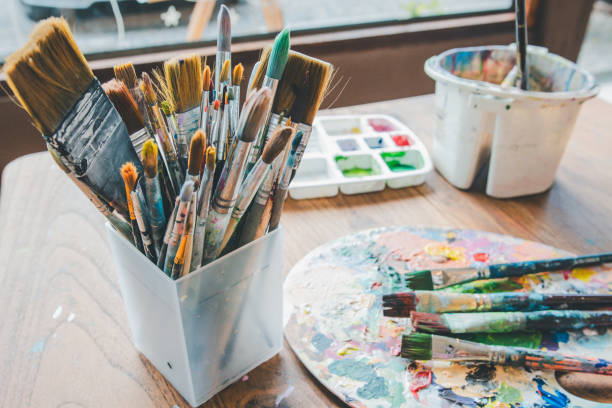 istock Close-up of several brushes used for painting placed on a table. 1755547641