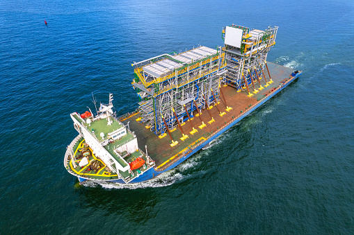 large cargo ship Transporting loads of oil rig parts