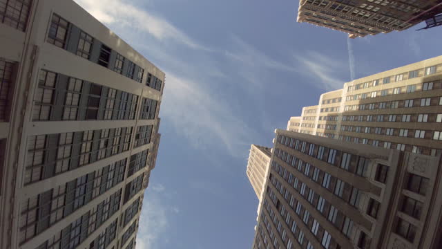 Looking up from the perspective of downtown Manhattan skyscrapers