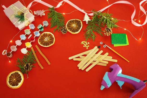 istock Step by step instruction how to make christmas toys from ice cream sticks. Step 1 1 preparation tools paints, brush and wood sticks for children New year craft. Children's New year handmade craft 1755570837