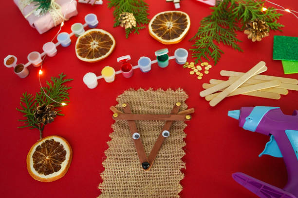 istock Step by step instruction how to make christmas deer from ice cream sticks. Step 5 glue the eyes and noseChildren's New year handmade craft 1755571396