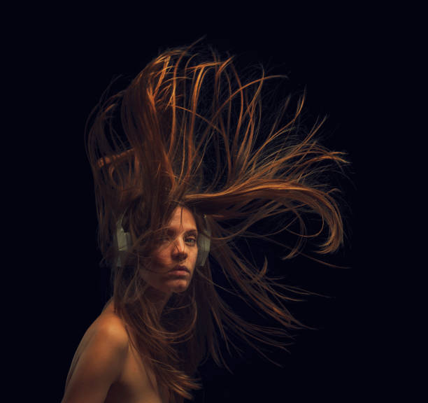 istock young woman with flying hair 1755578359