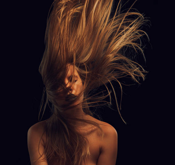 istock young woman with flying hair 1755578380
