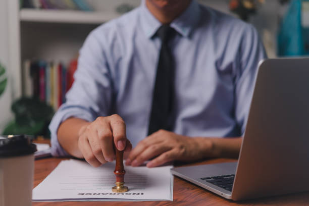 istock Man stamp rubber approve documents insurance finance certify at office 1755592464