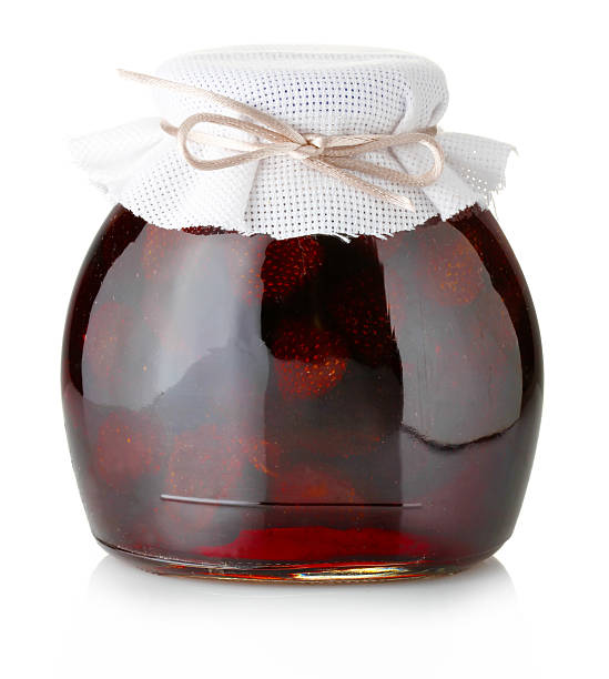 istock Strawberry jam with ripe strawberries isolated on white 175559602