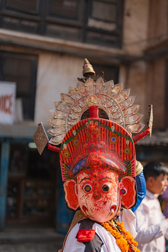 Ceremony with dancers  in colorful attire wearing masks in Bhaktapur, Nepal