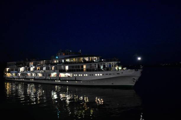 istock A steamboat illuminated by electric light floats on the river at night 1755600761
