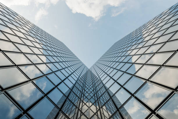 istock Skyscraper with Glass Curtain Wall Reflecting Sky and Clouds 1755602946