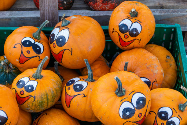 istock Funny Faces on Market Pumpkins 1755604148