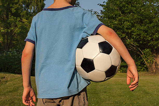 istock Boy with a football 175561042
