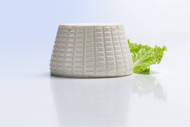 istock fresh ricotta with lettuce leaf on white background front view 1755610646