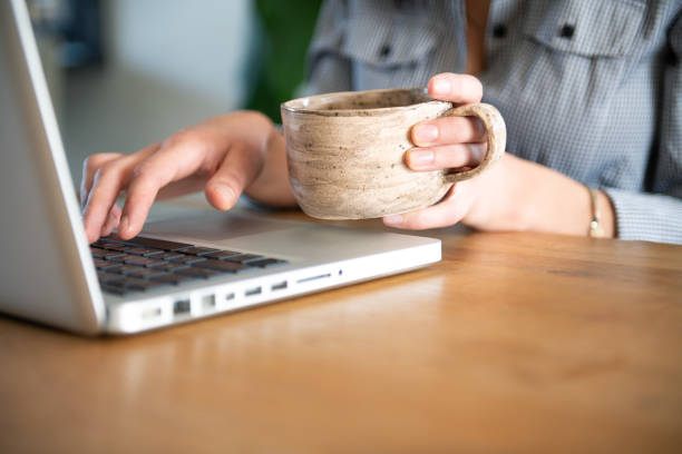 Young woman working from home on laptop